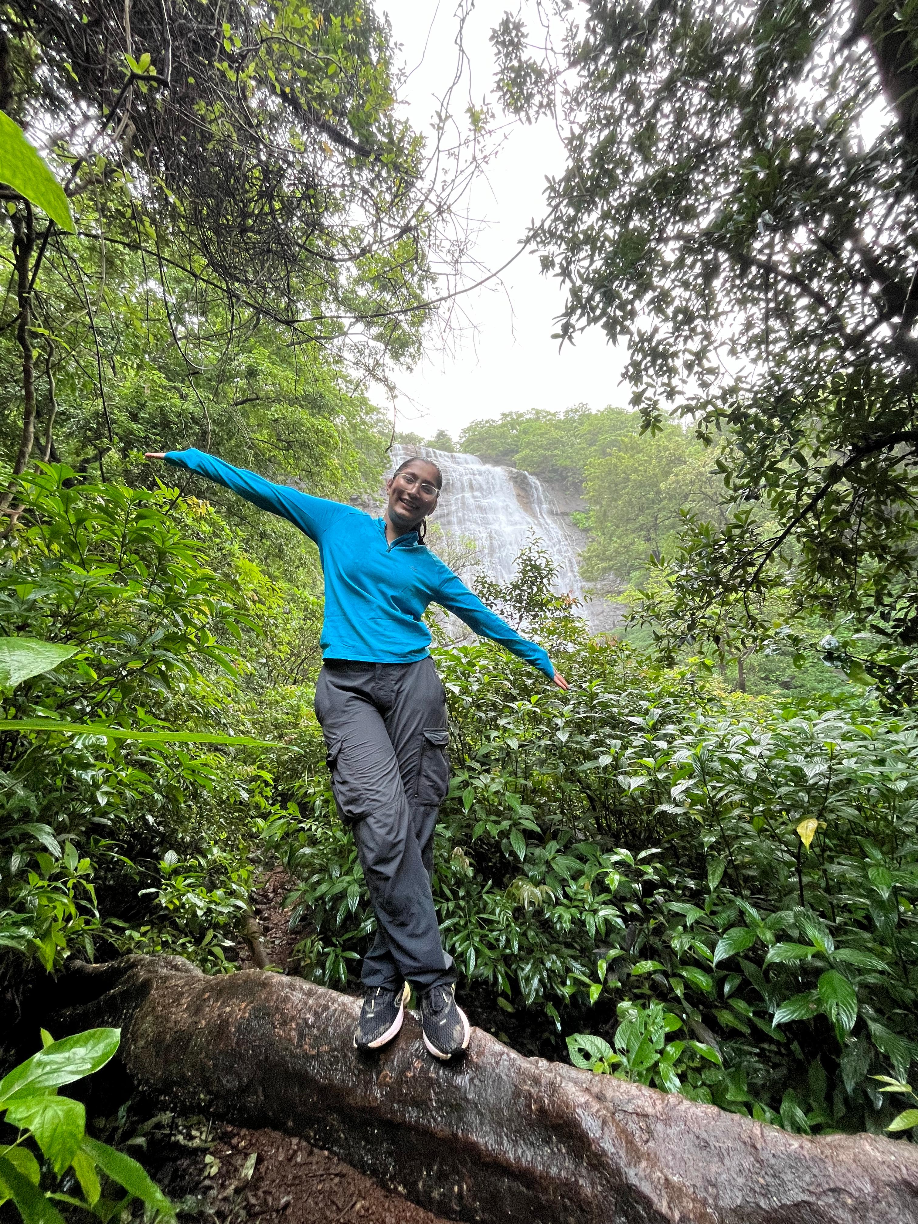 Snehal at waterfall in jungle