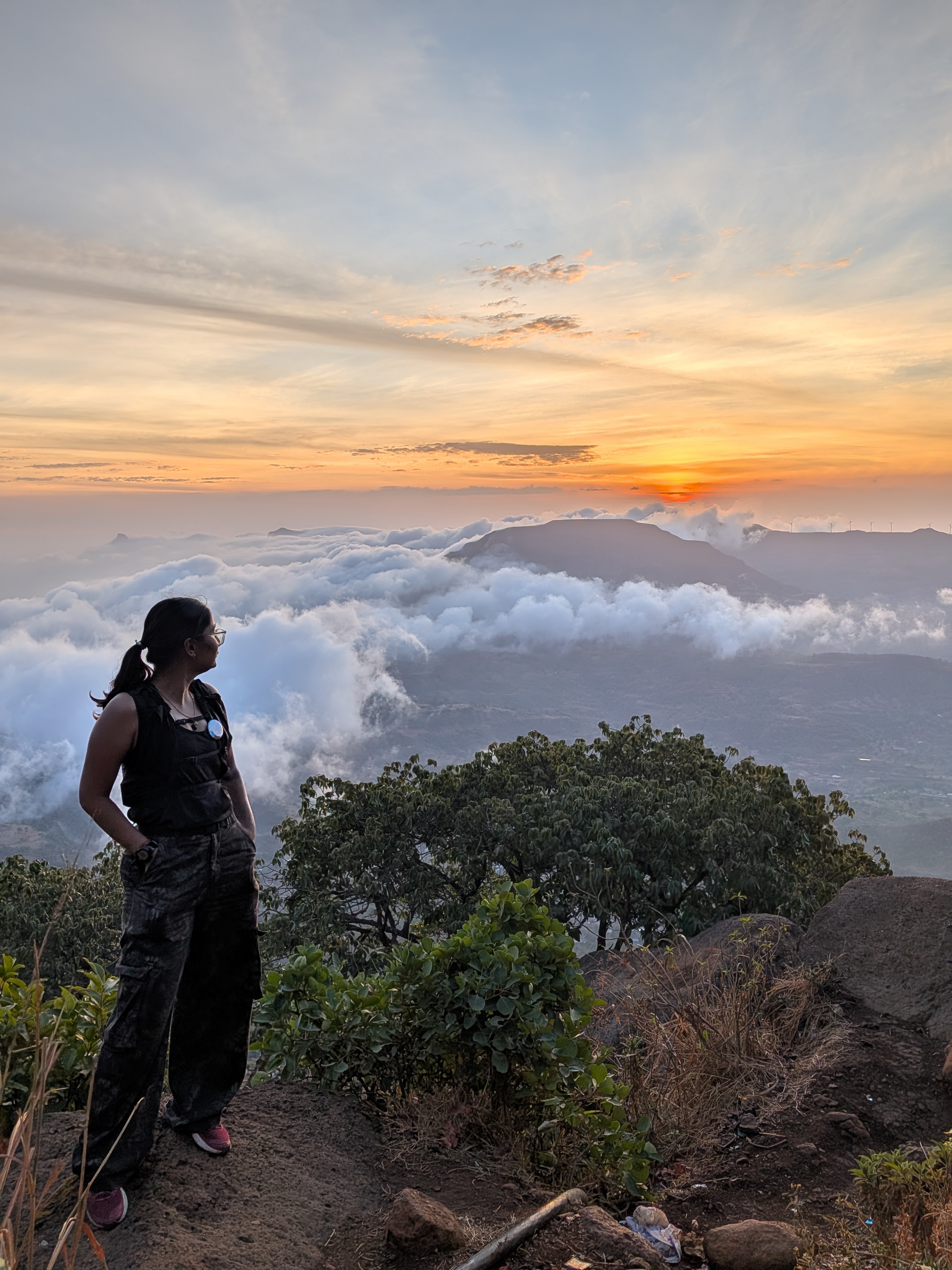 Snehal watching sunset above the clouds